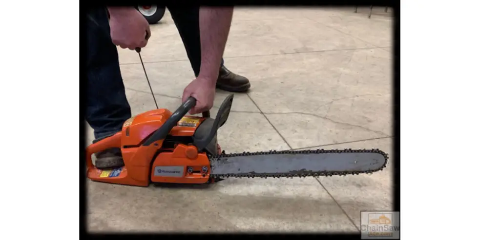 holding handlebar and foot rest on husqvarna 455 chainsaw