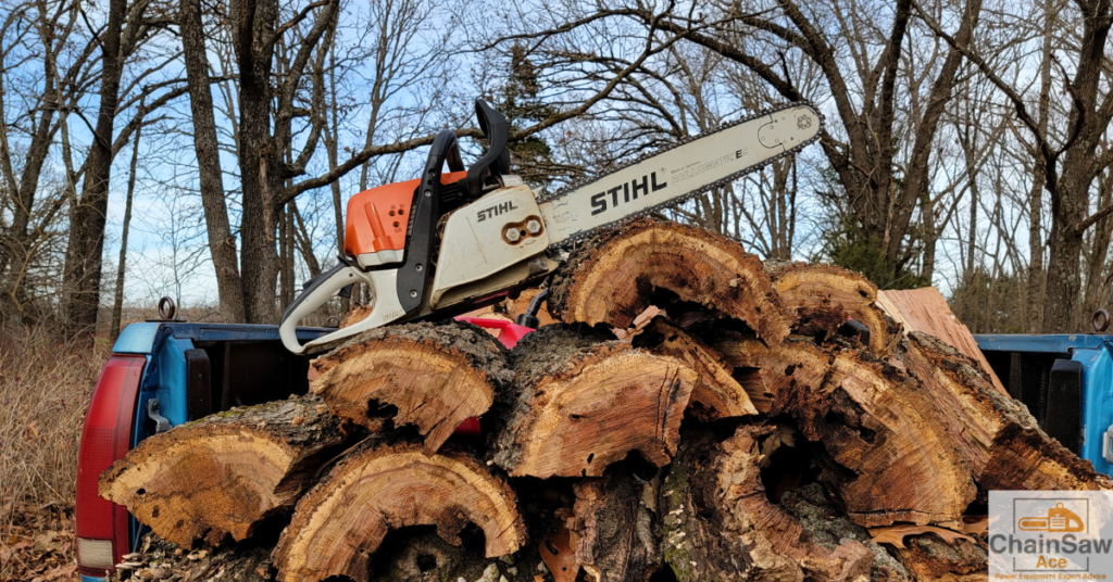 Stihl chainsaw sitting on firewood stack