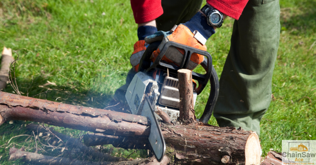 man cutting small log with Stihl chainsaw