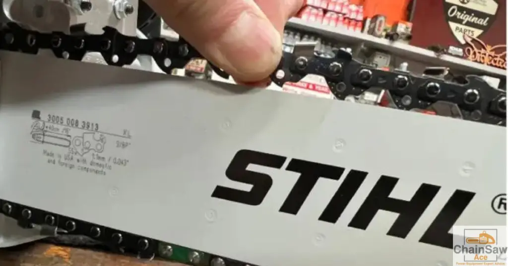 Checking the tension of a chainsaw chain - the snap test